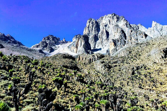 4 Days Mt Kenya Climb, Chogoria Route up and out Sirimon route - The Gorges Valley highlights: Lake Michaelson, the Temple, and the far peaks