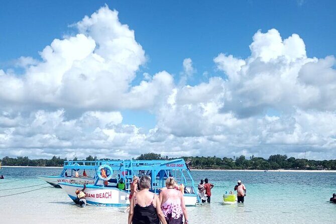 Diani Beach: Glass-bottom Boat Ride with Underwater Show - Sandbank stop: swimming, snorkeling, and a little celebration vibe